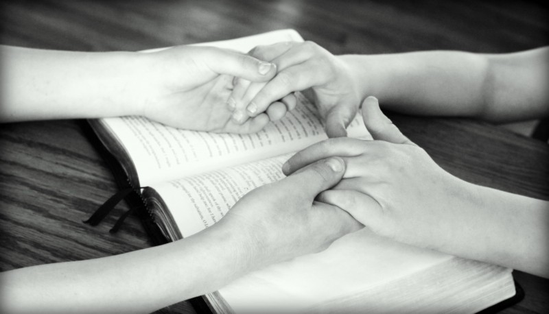holding-hands-bible-praying-friends-bible-study-2